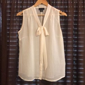 Sleeveless sheer ivory blouse